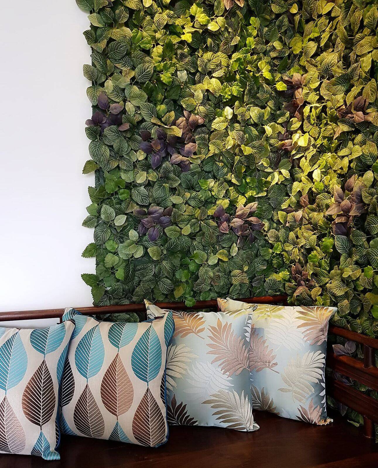 Vertical garden wall behind a daybed