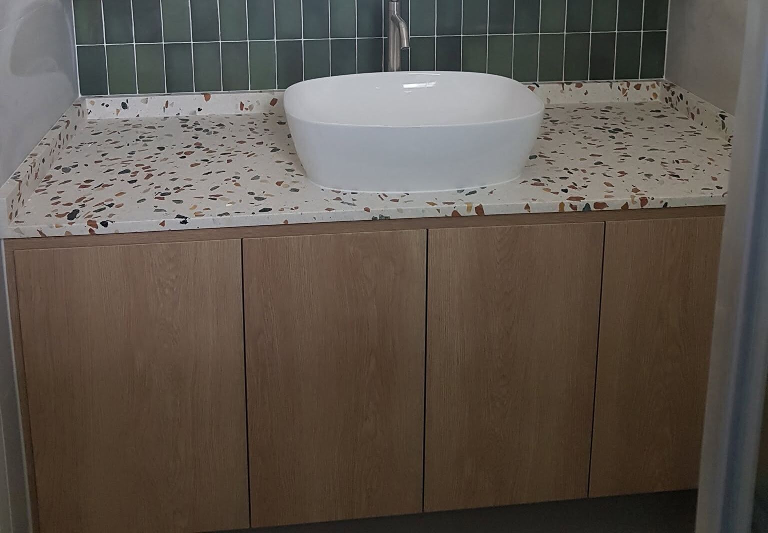 Bathroom vanity with vessel basin